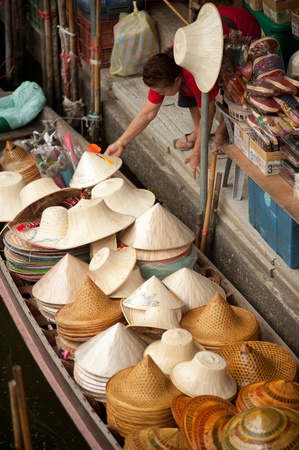 Ratchaburi,Thailand, July 21,2013 Hats sale on the boat and general view of Damnuan Saduak flaoting market  in Ratchaburi Province,Middle of Thailand のeditorial素材
