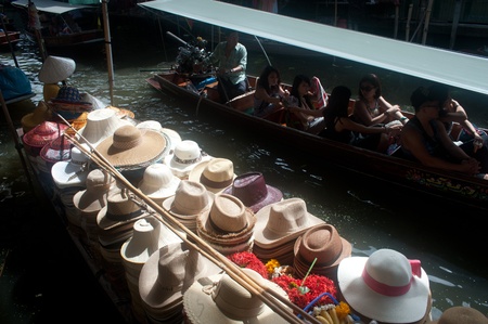 Ratchaburi,Thailand, July 21,2013 Hats sale on the boat and general view of Damnuan Saduak flaoting market  in Ratchaburi Province,Middle of Thailand のeditorial素材