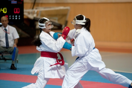 BANGKOK,THAILAND - SEPTEMBER 9  Female fighter between participants of Thailand Open Karate-Do Championship 2013 on Nimibutr National Indoor Stadium, September 9, 2013, Bangkok,Thailand  のeditorial素材
