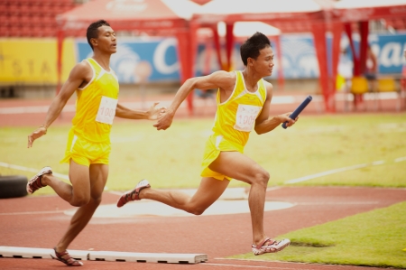 PHATUMTANI,THAILAND  SEPTEMBER,6   Groups of  player  action of  4 x 100 Relay in Thailand Open Athletic Championships 2013 at Thammashat University stadium on September 6,2013 in Phatumtani city ,Middle of Thailand  のeditorial素材