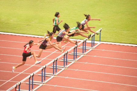 PHATUMTANI,THAILAND  SEPTEMBER,6   Groups of  player  action of 100 m  Hurdles in Thailand Open Athletic Championships 2013 at Thammashat University stadium on September 6,2013 in Phatumtani city ,Middle of Thailand  のeditorial素材