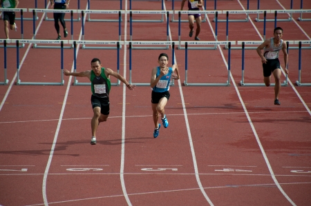 PHATUMTANI,THAILAND  SEPTEMBER,6  Groups of player action of 100 m Hurdles in Thailand Open Athletic Championships 2013 at Thammashat University stadium on September 6,2013 in Phatumtani city ,Middle of Thailand  のeditorial素材