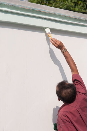 Male painting the wall の写真素材