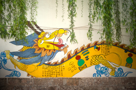 Dragon painting on a wall in Lijiang old town  のeditorial素材