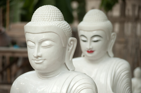 Group of Buddhas image then carved placed on the ground Held for sale and brought to the Myanmar temple in Mandalay city,Central of Myanmar.の写真素材
