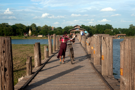 Villagers bike trailers on U-Bein Bridge,Myanmar.のeditorial素材