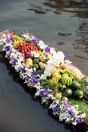 Flower and fruits with boat for show in floating market,Bangkok,Thailand.の写真素材