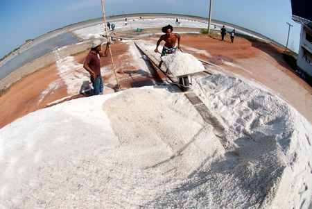 Workers are working at a salt farm in Thailand.のeditorial素材