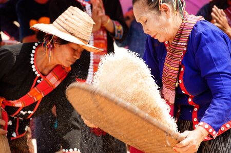 Unidentified Phutai minority competitive winnowing in The 2nd International Phutai Festival.