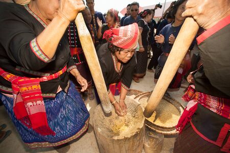 Unidentified Phutai minority competitive pounding in The 2nd International Phutai Festival.