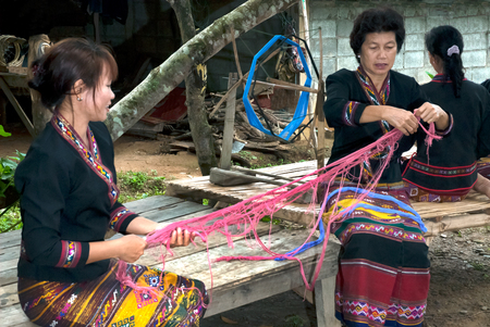 Lua or Thin Hill Tribe Minority spinning in Thailand.のeditorial素材
