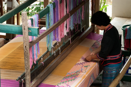 Lua or Thin Hill Tribe Minority weaving with loom in Thailand.のeditorial素材