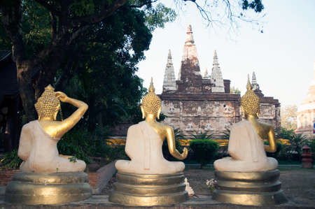 Three sitting Buddha front of Maha Chedi Wat Jhet Yot,Chiang Mai Province,Thailand.