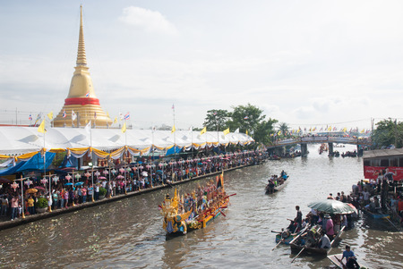 Group of peoples wait and throwing lotus to the boat on Rub Bua Festival,Thailand.のeditorial素材