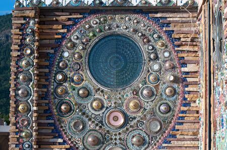 Hand made circular mosaic on Thai Buddhist Temple wall.のeditorial素材