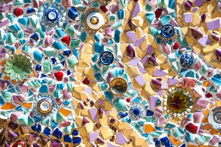 Hand made circular mosaic on Thai Buddhist Temple wall.のeditorial素材