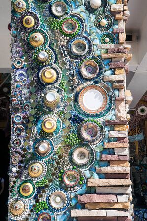 Hand made circular mosaic on Thai Buddhist Temple pole.のeditorial素材