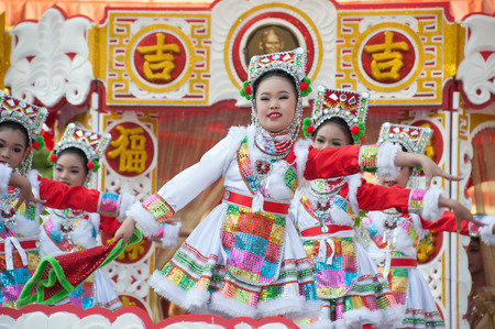 Young girls provide music for dance on the parade during Chinese New Year celebrations.のeditorial素材