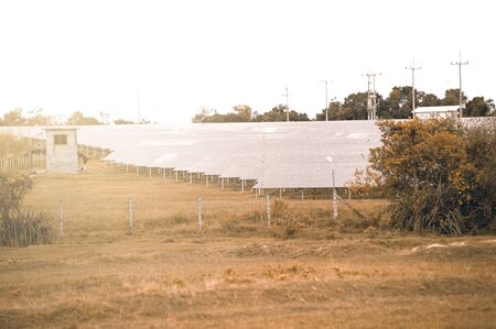 Solar panels (solar cell) in solar farm with sun lighting to create the clean electric powerの写真素材