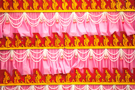 Traditional Thai art fabric decorated on the car in the Rocket Festival parade show.の写真素材