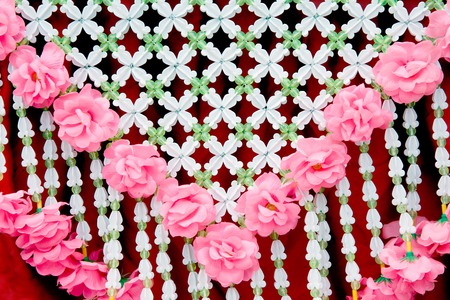 Traditional Thai flower garland hanging decorated on the car in the Rocket Festival parade show.の写真素材