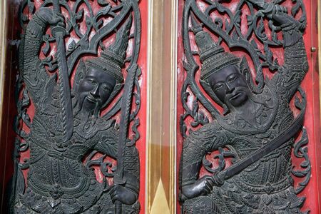 Thai art on Entrance door of Church at Wat Benchamabophit, the Marble temple Bangkok.の写真素材