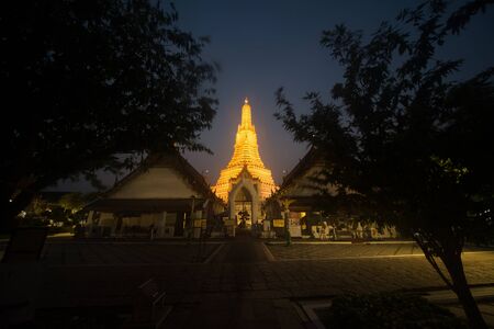 Sunset time at main Prang of Wat Arun Ratchawararam temple ,Bangkok,Thailand.の写真素材