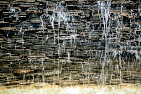 Detail of a decorative cascade waterfall in the garden.