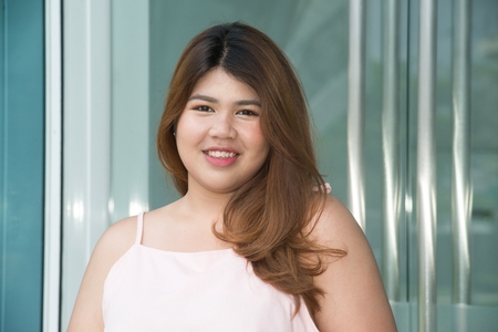 Portrait of Asian pretty smiley face fat woman posing.の写真素材