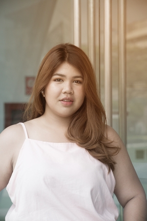 Portrait of Asian pretty smiley face fat woman posing.の写真素材