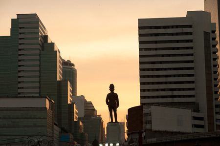 Silhouette of Sunset at King rama VI monument located at the front of Lumpini park Bangkok Thailand.のeditorial素材