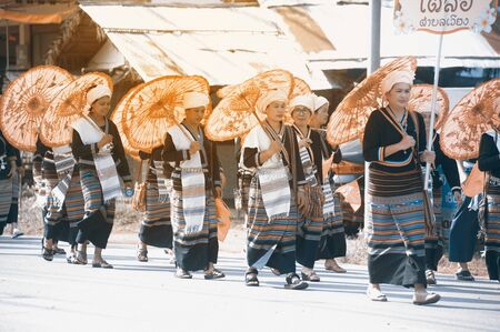 PHAYAO, THAILAND - MAY 9, 2015 : Unidentified minority in Northern of Thailand in a row walking in a parade on the street showing in 8th Ethnic amazing festival at Chiangkum, Phayao Province, Thailand.のeditorial素材