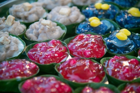 Thai dessert sweet is Creamy Coconut Tapioca and Corn Pudding with Coconut Ta-go topping and wrapped...