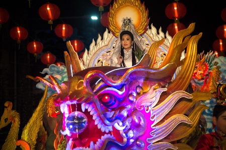 NAKHONSAWAN , THAILAND - FEBRUARY 18,2018 : Unidentified pretty woman is symbol Guan Yin of God on the night parade during Chinese New Year celebrations in Nakhonsawan Province , Middle of Thailand.のeditorial素材