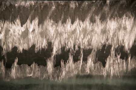 Abstract and close up of transparent falling water vertical flows.の写真素材