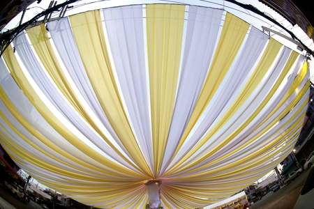 The fabric that is stretched is a large sun-shading tent.の写真素材