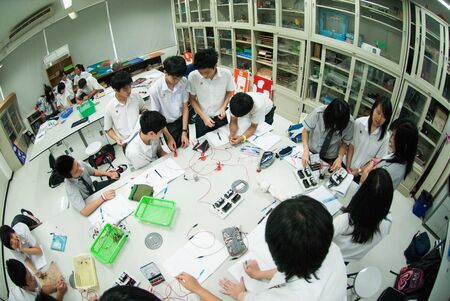 BANGKOK,THAILAND - MARCH 30,2009 : Unidentified group of Asian elementary students are learning...
