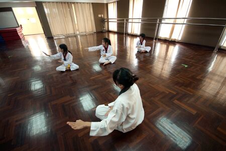 BANGKOK,THAILAND -MARCH 21,2009 : Unidentified young students are learning about skills training multi ethical karate position classroom at Amnuay Silpa school , Bangkok capital city, Thailand.のeditorial素材