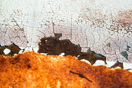 Rusty metal white painted background with streaks of rust. Rust stains and the metal surface rusted spots.metal rust texture.の写真素材