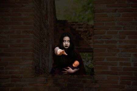 Ancient Thai ghost in traditional costume that appear in History. The uniqueness of the dress of Thai traditional style, woman wearing typical Thai dress, Ghost, Halloween woman and devil woman concept. Mae Nak Phra khanong ghost stories about the death is best known for the Thai people.の写真素材