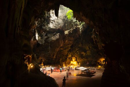 PHETCHABURI,THAILAND-AUGUST 12,2019 : Main golden sitting Buddha and row of ancient Buddhas amulet...