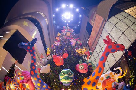 Light and doll decorate beautiful on Christmas Tree Celebration in Thailand.の写真素材