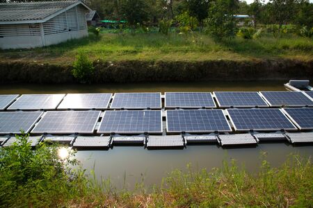Solar power generation panel Installed on the water in the pond, reflecting the sun and blue sky...
