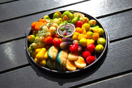 Fruit shaped like a clear glass The inside is made of nuts in jelly that imitates fruit. Is a traditional Thai dessert.の写真素材
