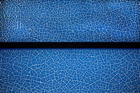 Texture and background of Traces of blue broken on the bright glass inside.
