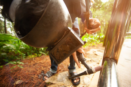 Welders weld metal fences by welding machines.の写真素材