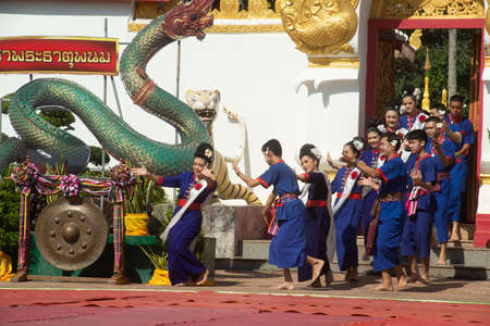 NAKHON PHANOM,THAILAND-OCT 2,2020 :Unidentified people traditional dancing parade on the Wat Phra That Phanom Woramahawihan is held every year at the end of the Buddhist Lent. This work for worship.のeditorial素材