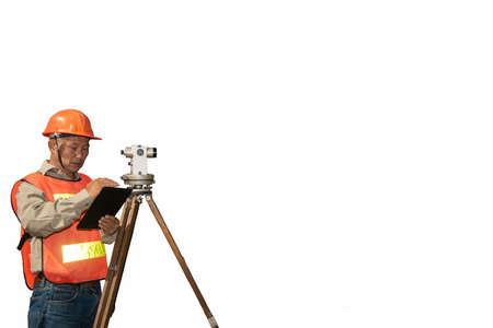 Engineer or surveyor working with theodolite  equipment at road construction site with isolated and clipping path.の写真素材