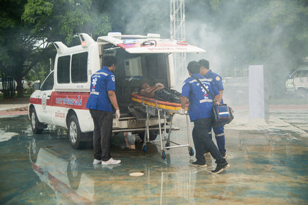 Unknown rescuers and fire brigade Conduct rescue drills by pulling wagons with the injured. Put a ventilator in your throat and take it to an ambulance.のeditorial素材
