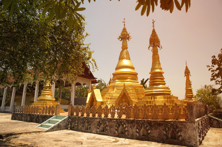 Golden Pagoda at Wat Somdet, a historic site in Amphoe Sangkhlaburi, Kanchanaburi Province ,Thailand. A combination of Thai-Raman and Myanmar art.の写真素材